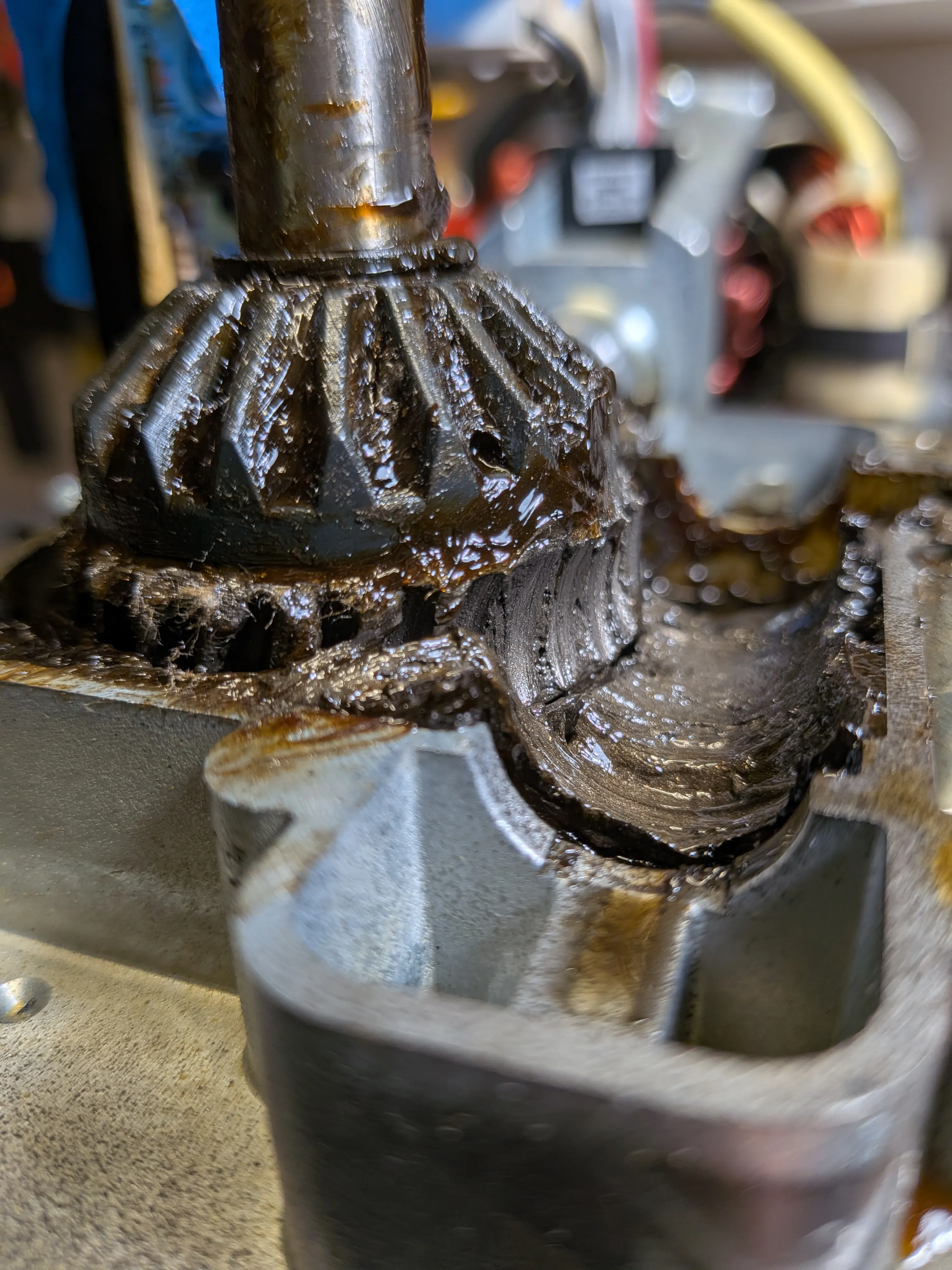Close-up of worn and damaged gears inside a bowl-lift KitchenAid mixer